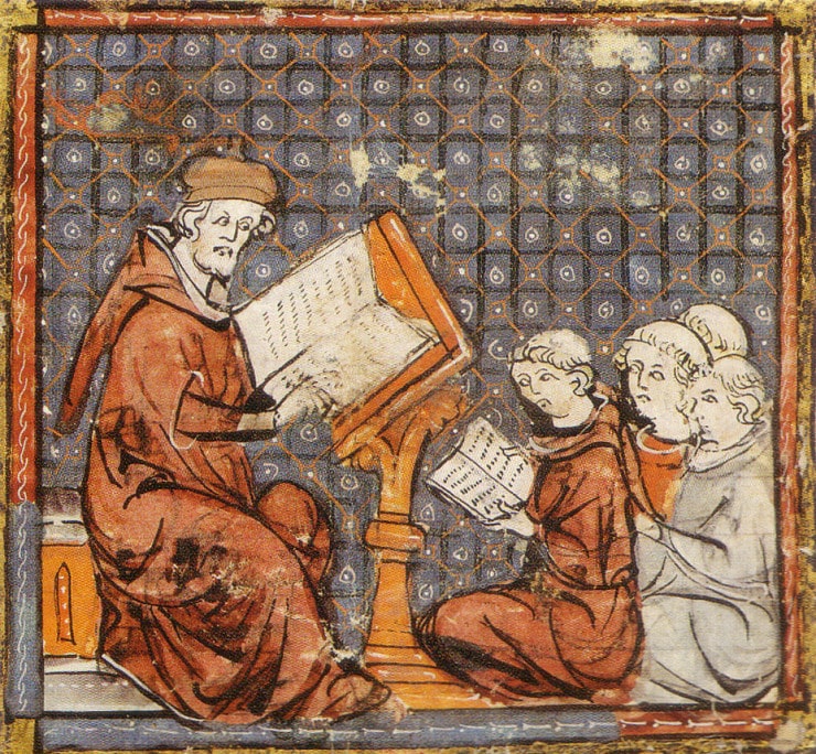 Teaching at Paris, in a late 14th-century Grandes Chroniques de France- the tonsured students sit on the floor Hogwarts